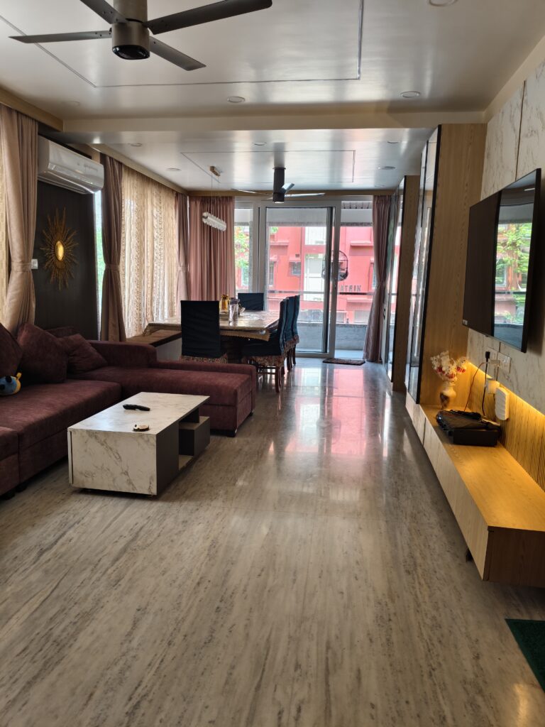2BHK living dining room interior design New Town Kolkata luxury TV unit